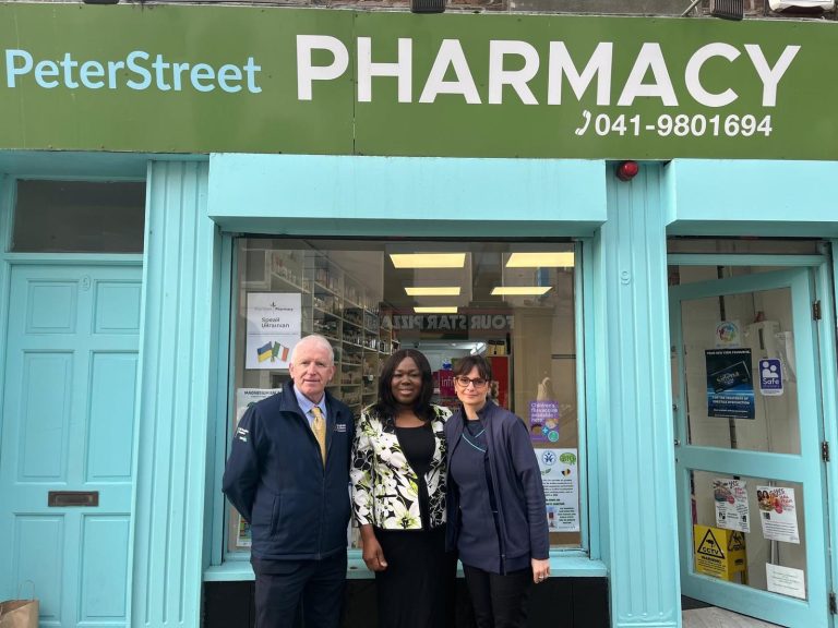 Pharmacy team helping a customer